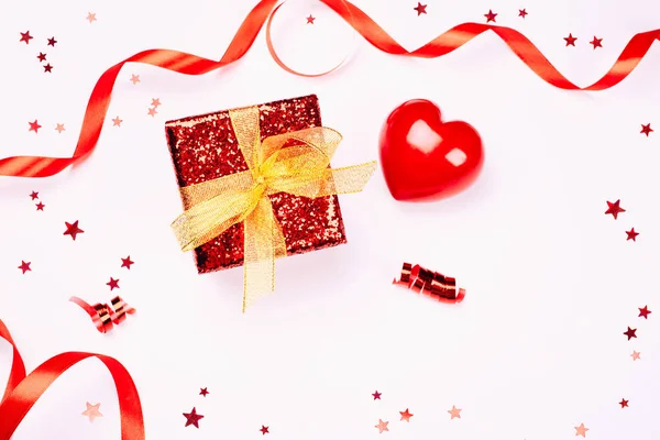 Red gift box with golden ribbon — Stock Photo, Image