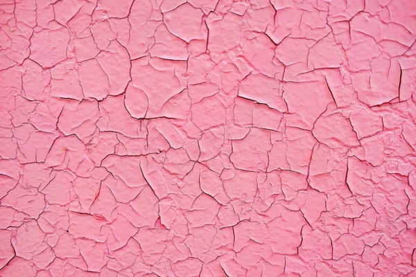 质地的裂纹粉红色油漆 在墙上剥落纹理 乡土垃圾材料的模式 — 图库照片