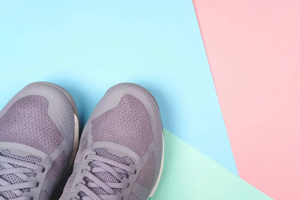 Grey sneakers on pastel background — Stock Photo, Image