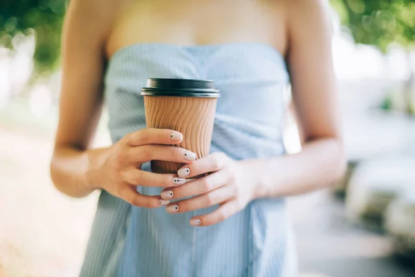 Hands with manicure and coffee cup — Stock Photo, Image