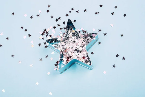 Star with sparkles on blue background