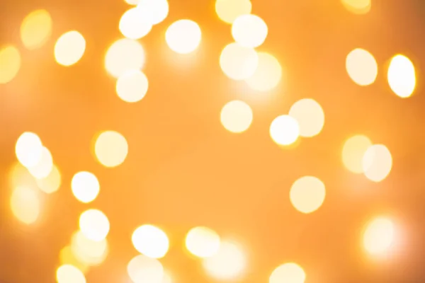 Blurred golden festive lights — Stock Photo, Image