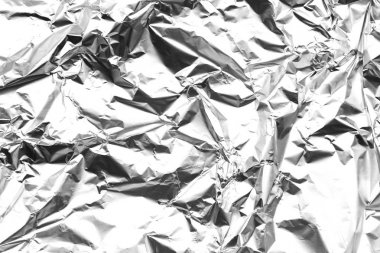 Abstract background made of textured aluminum foil. clipart