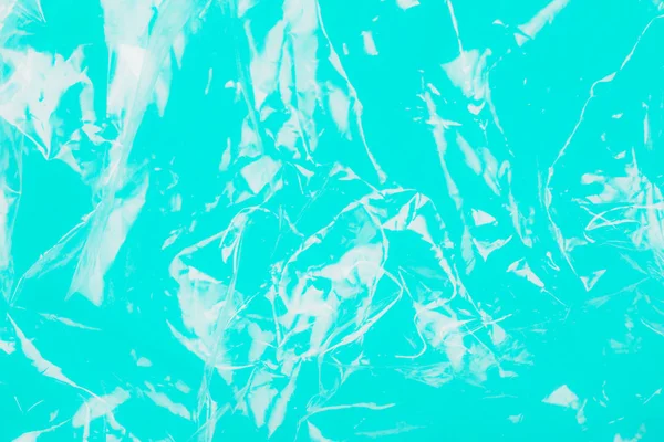 Abstrakt plast konsistens på Teal bakgrund. — Stockfoto