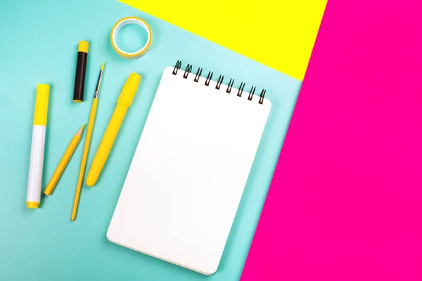 School supplies on yellow and pink background — Stock Photo, Image