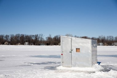 Ice Shanty on a Frozen Lake clipart