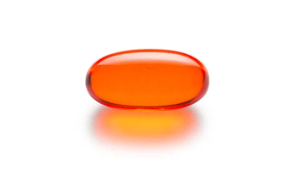 Capsule de gélatine orange isolée sur blanc — Photo