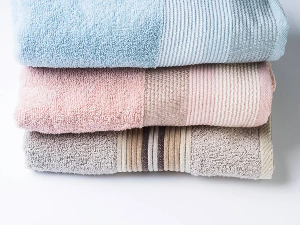 Pastel color clean folded towels on white — Stock Photo, Image