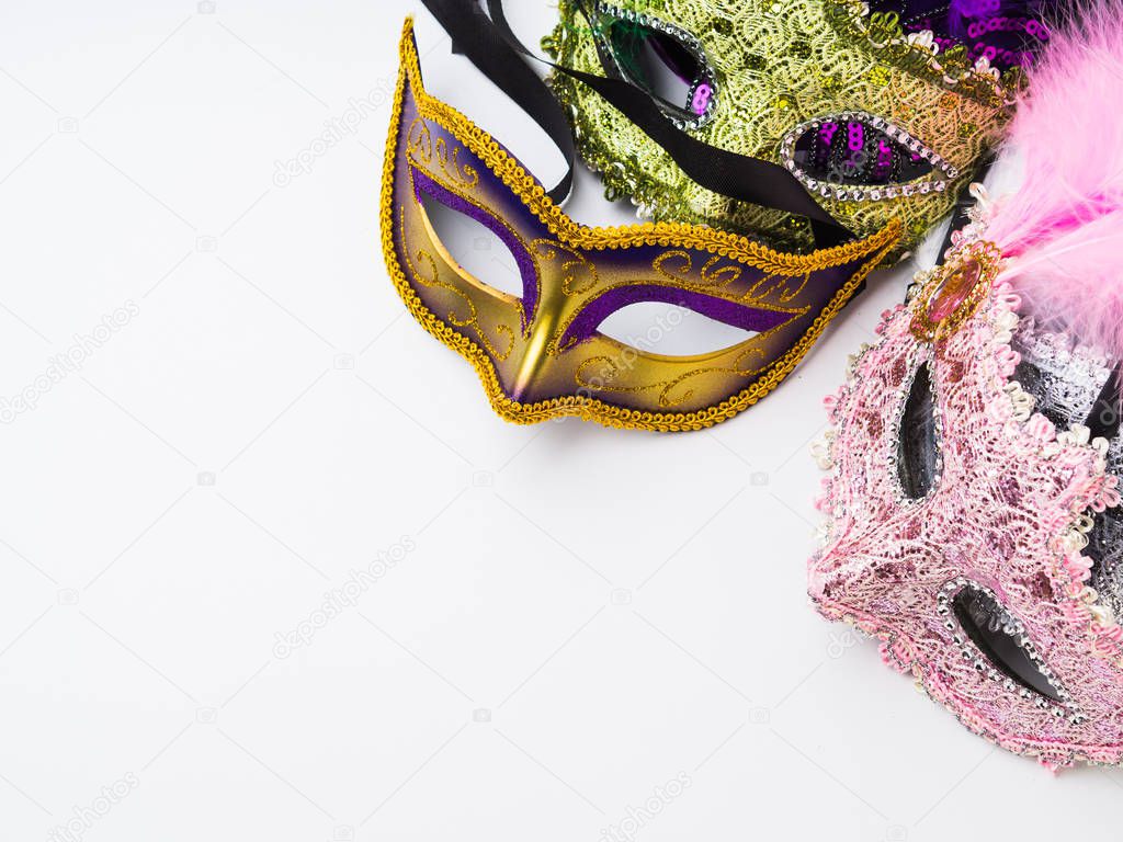 Colorful carnival masks on white background