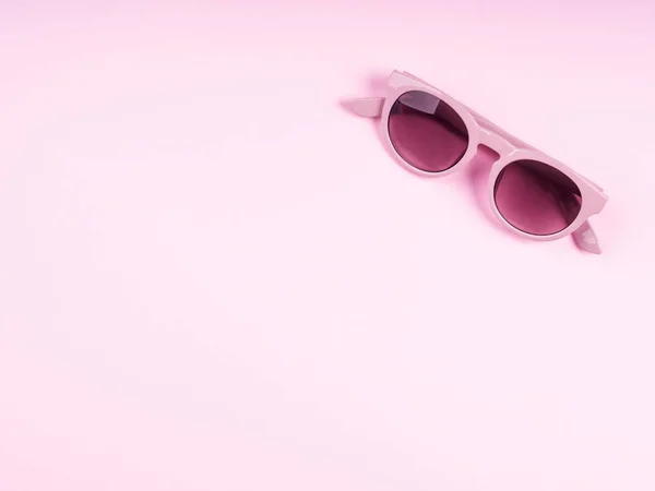 Pink sun glasses on monochrome backdrop — Stock Photo, Image