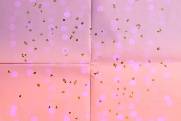 Rosa pappers bakgrund med stjärnor och ljus — Stockfoto