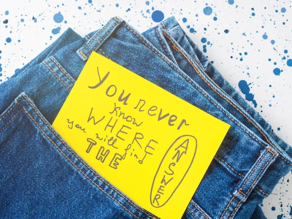Jeans pocket closeup with inspirational quote