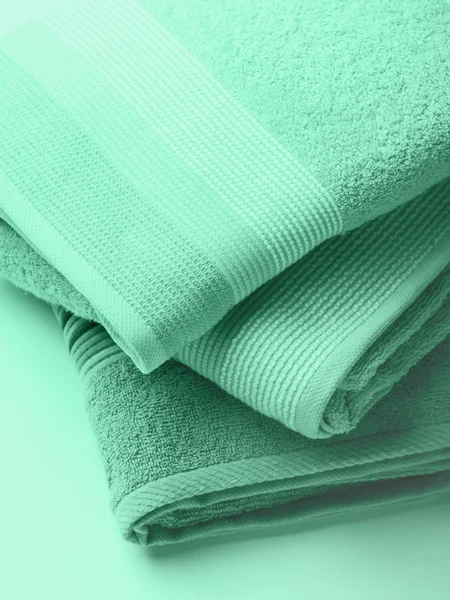 Pastel color clean folded towels. Mint green