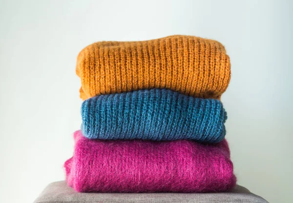 Cozy winter colorful woolen sweaters — Stock Photo, Image