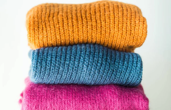 Cozy winter colorful woolen sweaters — Stock Photo, Image