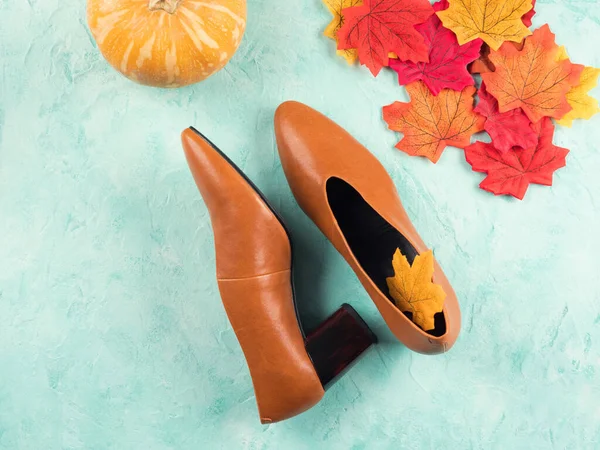 Female trendy fall color shoes with leaves
