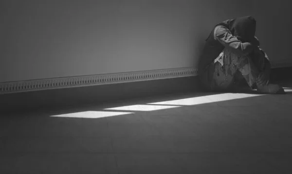 Side View Hopeless Man Sitting Alone Hugging His Knees Floor — Stock Photo, Image
