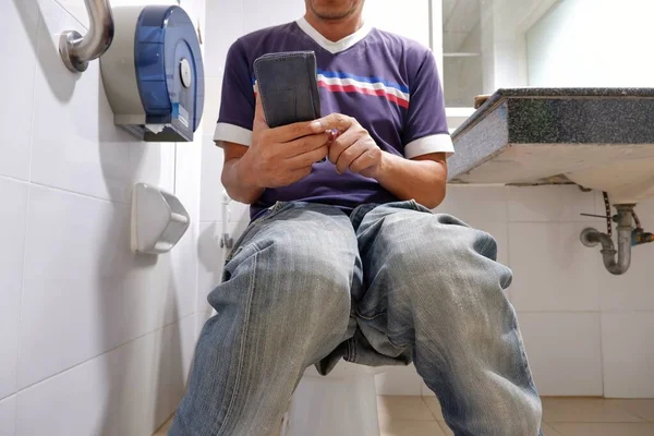 Midsection Man Using Smartphone While Sitting Toilet Bowl Home Technology — Stock Photo, Image