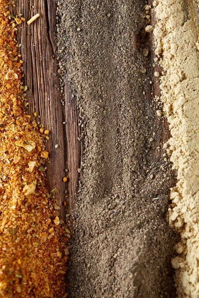Colorful spice background with different color spices, macro, selective focus, vertical, selective focus.