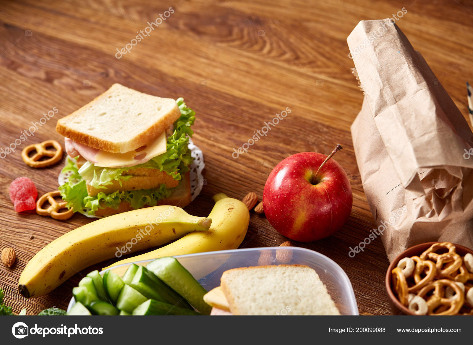 Concept of school lunch break with healthy lunch box and school