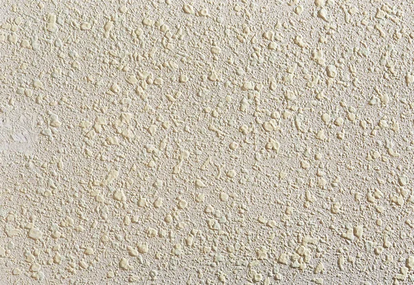 ベージュは石膏テクスチャ背景です。ベージュの漆喰。壁に漆喰の質感. — ストック写真