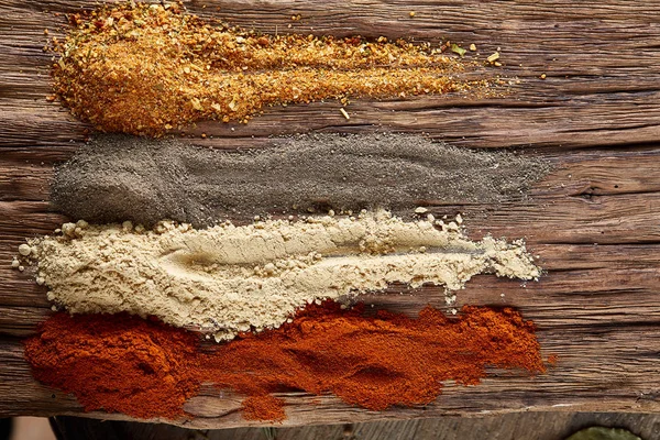 Colorful spice background with different color spices, macro, selective focus, shallow depth of field.