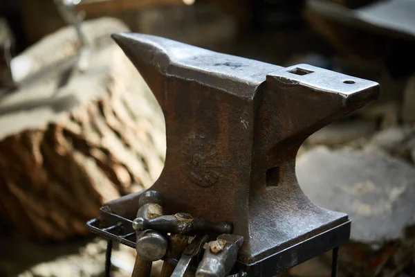 Big heavy anvil in the blacksmiths workshop, close-up, selective focus.