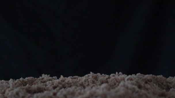 Cross Fell Sand Black Background Video Slow Motion Stock Footage