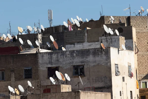 Fez, Morocco, 01.02.2020 many satellite dishes on roofs of buildings against sky Stock Image