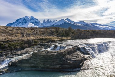 Waterfall and granite towers at Torres del Paine national park of Chile clipart