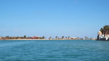 Buildings and beaches in El Gouna. El Gouna - a tourist resort on the Red Sea coast in Egypt. View from a floating ship.