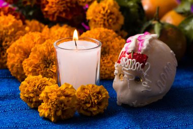 Day of the Dead candle and sugar skull whit cempasuchil flower background clipart