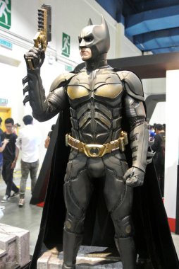 KUALA LUMPUR, MALAYSIA -MARCH 31, 2018: Fiction character of Batman from DC movies and comic. Batman action figure toys in various size display for the public. clipart
