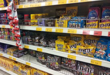 KUALA LUMPUR, MALAYSIA -SEPEMBER 20, 2018: Various chocolate type and taste in the plastic packaging. Displayed in the supermarket rack for sale.  clipart