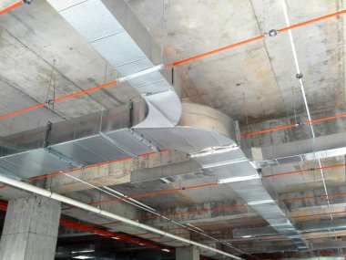 KUALA LUMPUR, MALAYSIA - SEPTEMBER 16, 2017: Air-condition and ventilation duct installed by construction workers  at the construction site. Distribute cool air and control the temperature.   clipart