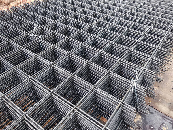 BRC welded wire mesh or BRC fabric used as part of the main structural component in floor slab structure element in the construction site. Comes in various size depend on design.  