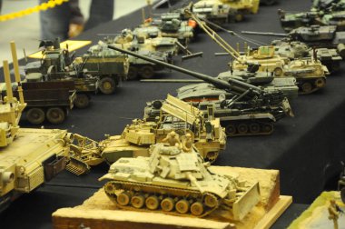 KUALA LUMPUR, MALAYSIA -OCTOBER 6, 2018: Selected focused miniature model of military tanks and amour vehicles. Display for public by collector. clipart