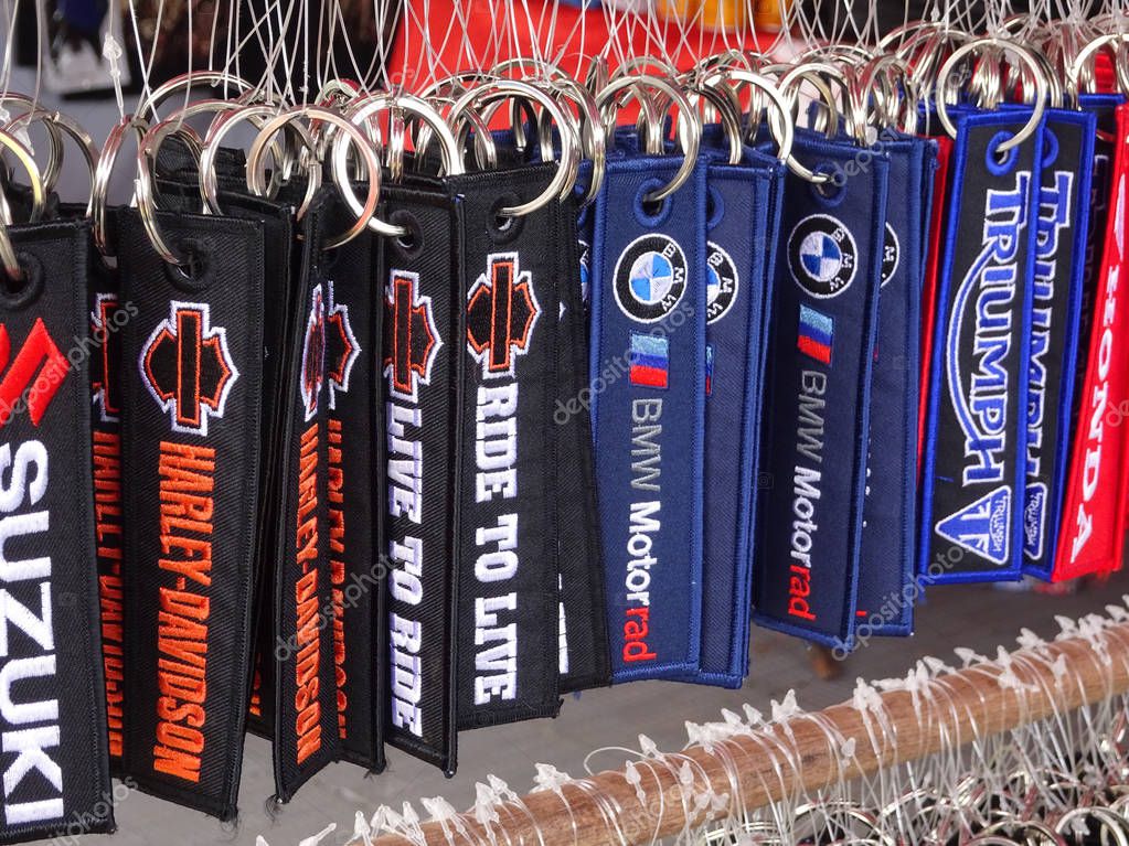 KUALA LUMPUR, MALAYSIA -MARCH 16, 2018: Keychain made from thick fabric. Popular motorcycle brand logo and brand name embroidered on top of it.
