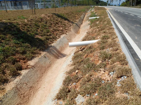 Cast-in-situ roadside drain used to channel rainwater from street to the monsoon drain or bigger drain.