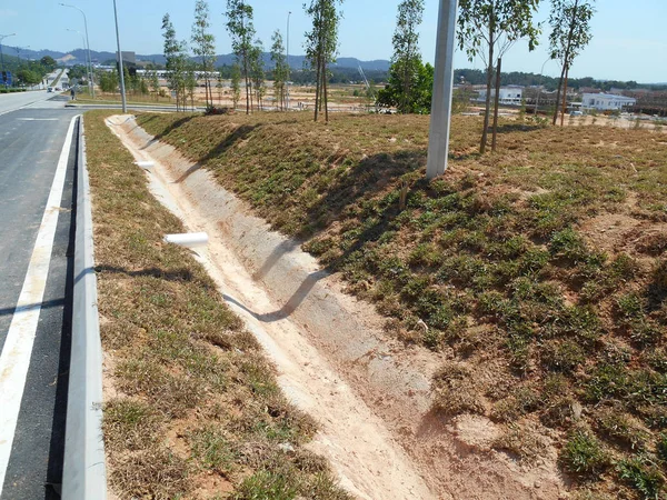 Cast-in-situ roadside drain used to channel rainwater from street to the monsoon drain or bigger drain.