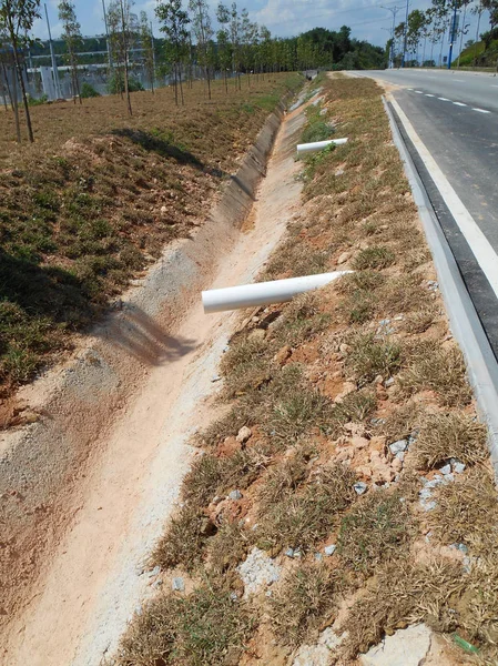 Cast-in-situ roadside drain used to channel rainwater from street to the monsoon drain or bigger drain.