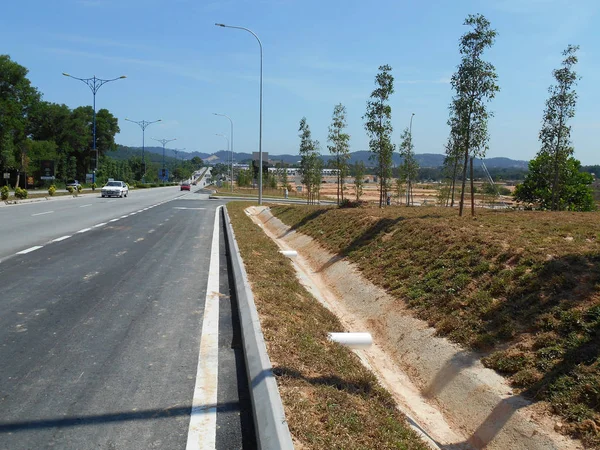 Cast-in-situ roadside drain used to channel rainwater from street to the monsoon drain or bigger drain.