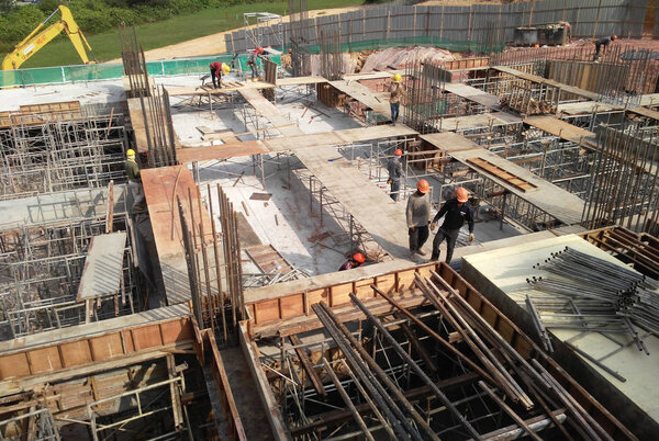 KUALA LUMPUR, MALAYSIA -JULY 28, 2017: Construction workers fabricated timber formwork at the construction site. Formwork made from plywood and timber. 