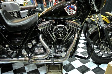 KUALA LUMPUR, MALAYSIA -JULY 29, 2017: Closed up and selected focused on a big motorcycle engine. Huge engine and latest technology produced high capacity horsepower to the motorcycle.   clipart