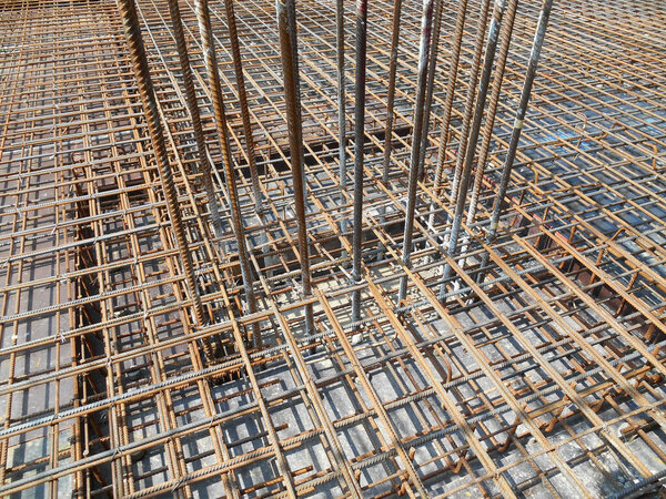 Hot-rolled deformed steel bars or steel reinforcement bar tied together before casting in the concrete. Its function is to increase the concrete strength. 