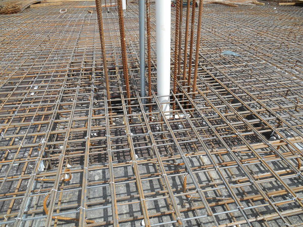 SELANGOR, MALAYSIA -MAY 18, 2016: Hot rolled deformed steel bars or steel reinforcement bar tied together before casting in the concrete. Its function is to increase the concrete strength. 