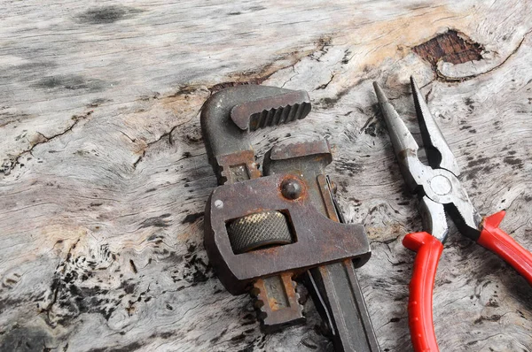 Long Nose Pliers Adjustable Wrench Wood Grain Background — Stock Photo, Image