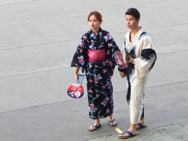 SELANGOR, MALAYSIA -JULY 22, 2017: Japanese teenagers girl wearing Yukata the traditional Japanese woman cloth during Bon Odori Festival at Shah Alam, Selangor, Malaysia. 