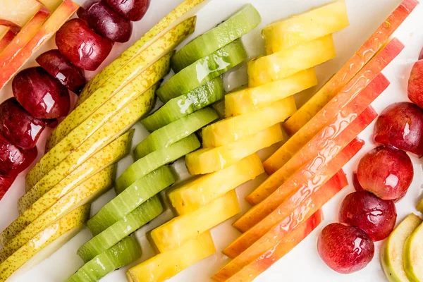 Eat a Colorful Variety of Fruits every Day for Better Health. colorful of sliced fruits.