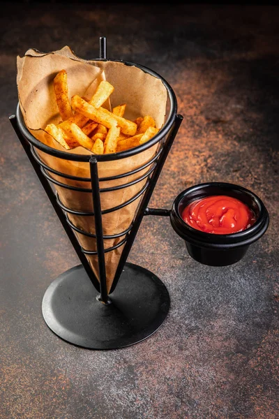 French fries in a paper bag with sauces. Top view. — Stock Photo, Image